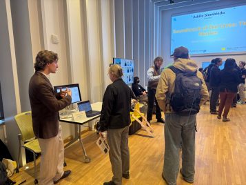 Jake Sachs standing by and explaining his project, "Icarus."